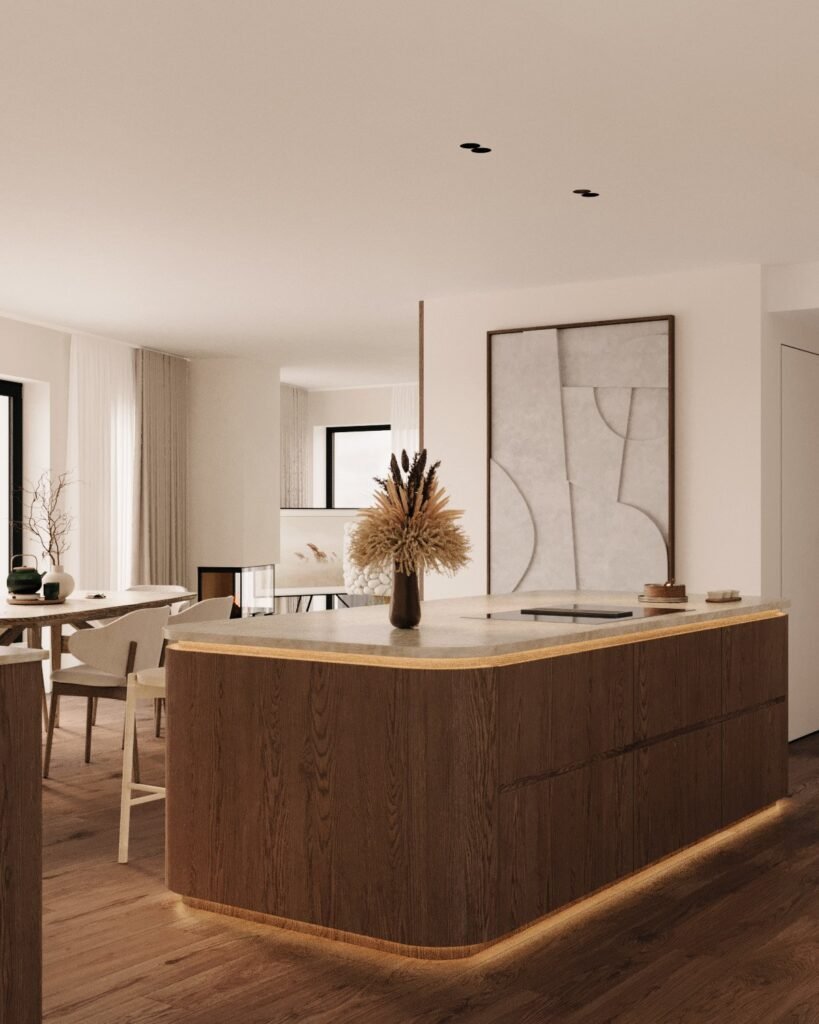 Stiligt - Modern köksinredning av en arkitekt köksdesigner, med en böjd träö, bänkskiva i marmor, minimalistisk inredning, neutrala toner, väggkonst och stora fönster som fyller utrymmet med naturligt ljus. Så samarbetar du med arkitekt eller köksdesigner: Expertens tips!