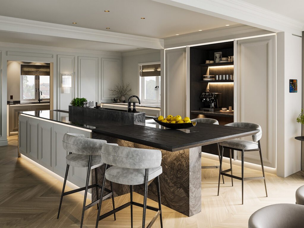 Stiligt - Modernt kök med en stor köksö, bänkskiva i marmor, grå stoppade barstolar, inbyggda hyllor, dold kaffestation och belysning under skåpen. Skål med citroner på köksön.